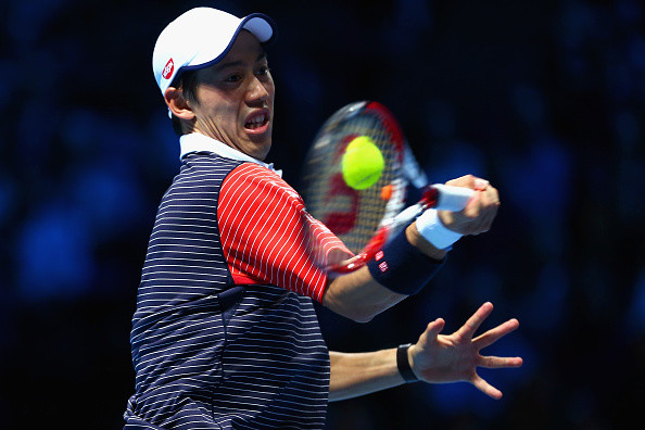 Kei Nishikori wearing UNIQLO polo shirt plays at 2014 ATP Tour Finals. 