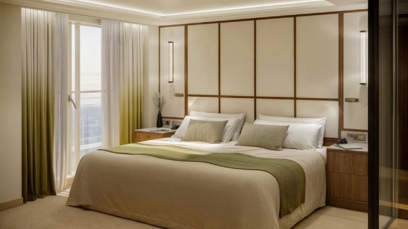 Crystal Grace Junior Penthouse Suite Schlafbereich mit Doppelbett und Meerblick