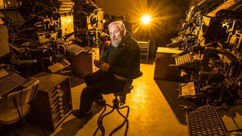 Michael sitting among the Museum's Linotype machines. Image from The Age (online), March 29th, 2018, by Jason South