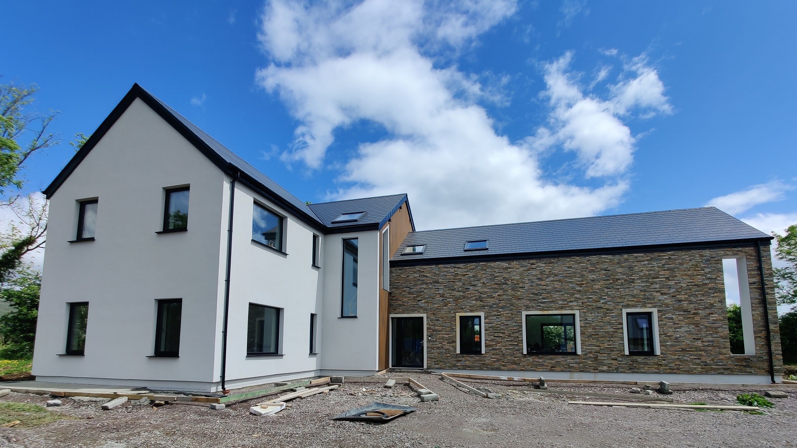 new build with external wall insulation and windows, installed in the insulation layer