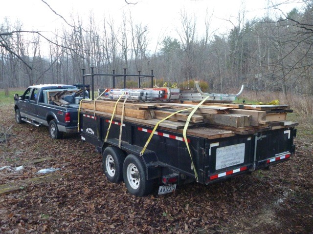 The building is tightly packed onto a 16' trailer and truck bed