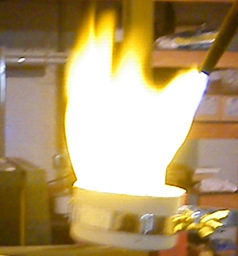 The melt must be timed with the end of the burnout so the molten precious metal is pured into a red-hot flask to help enure the mold is filled.