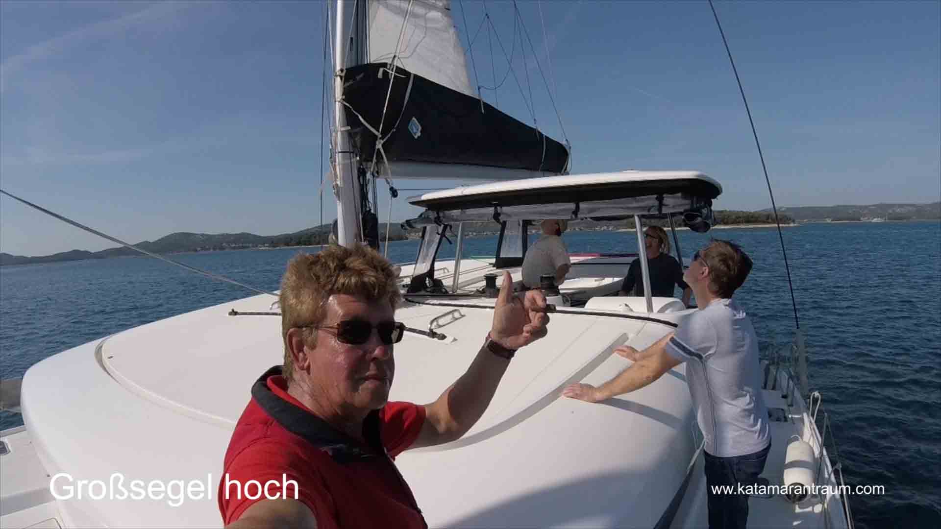During the skipper training the catamaran training participants independently lift the sails