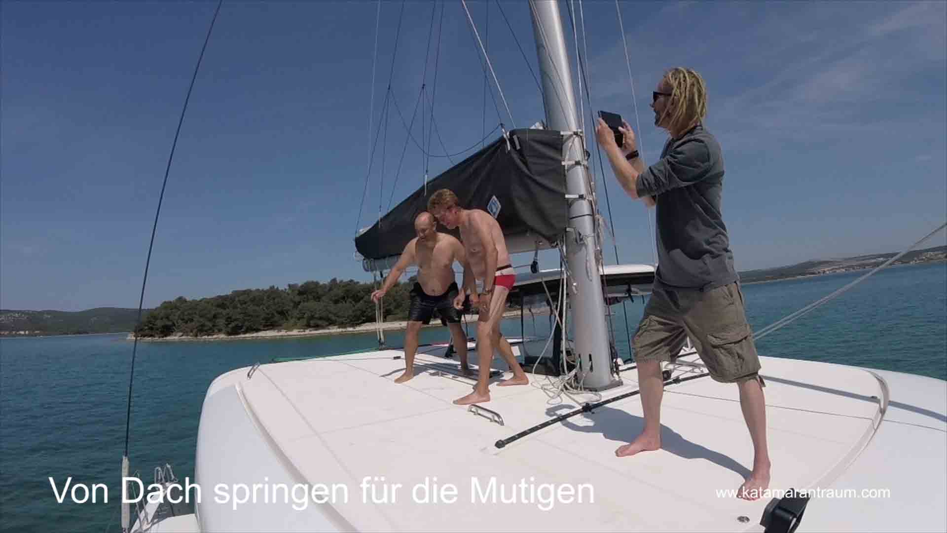 Brave catamaran training participants jump from roof of our Lagoon 42 JANNY