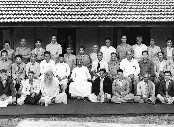 Meher Baba with his male followers. Babadas is seated in the front row.