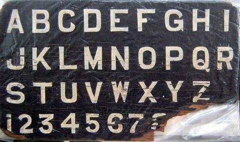 An early alphabet board that Meher Baba used.