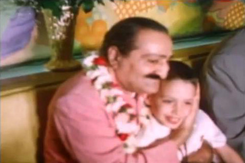 Meher Baba embracing a young Larry Karrasch. Image captured by Anthony Zois from a film by Sufism Reoriented.