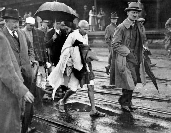 1931 : Folkstone, England. Gandhi walking from the ferry to a waiting car to take him to London. WINTER !