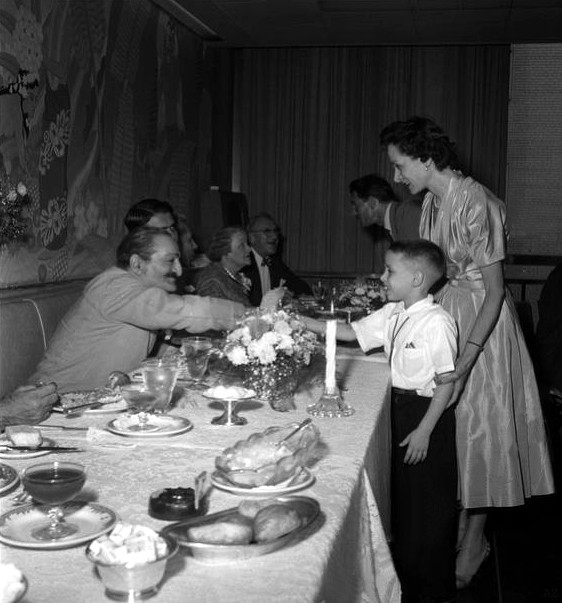 Annarosa and her son Larry meet Meher Baba at Longchamps restaurant in 1956.