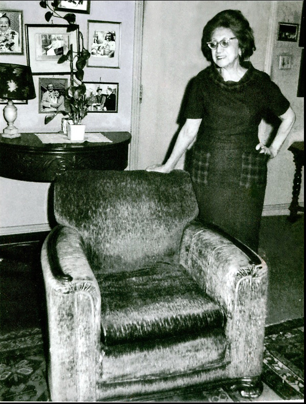 Hilda Fuchs with the arm-chair that Meher Baba sat in during his visit to California. This chair was later donated to the Sth California Meher Baba Center.