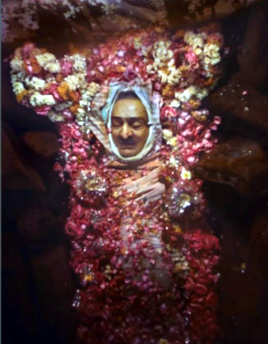 Blocks of ice surround Baba's body for the 7 days darshan.