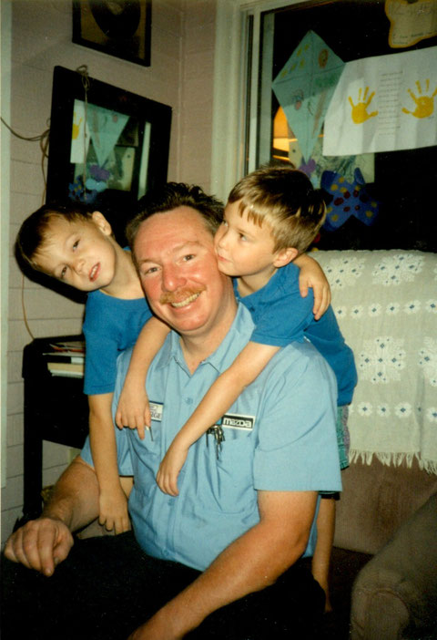 George with his twin sons ( L ) Charlie & ( R ) Tommy