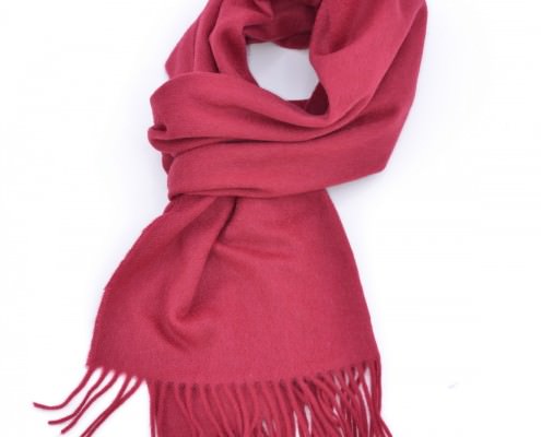 A typical pink muffler scarf worn .