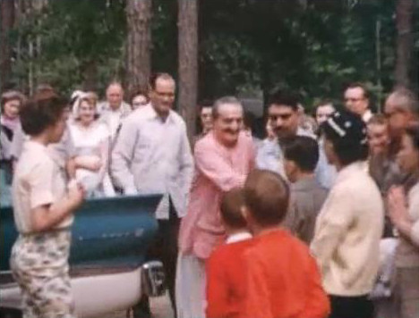 Baba with Nariman Dadachanji standing behind him