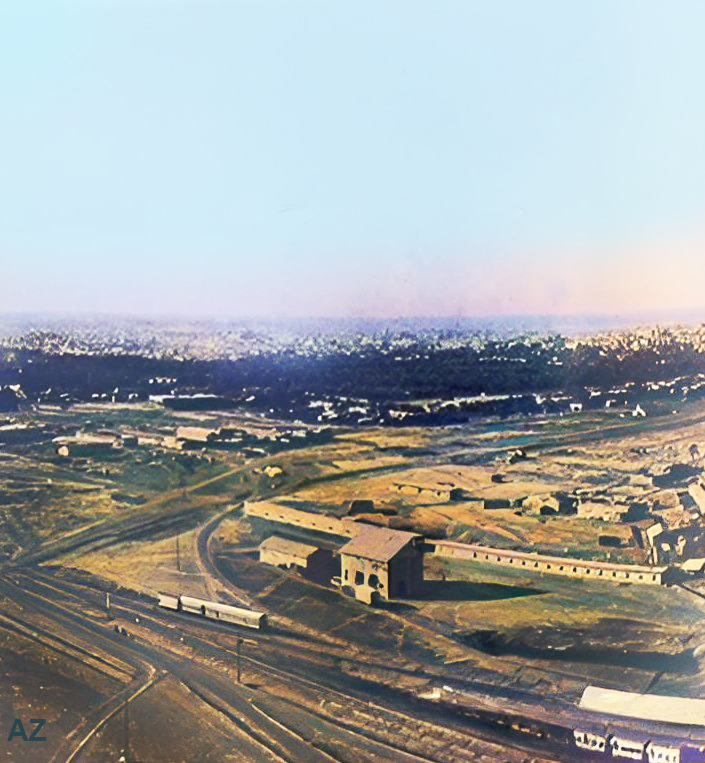 1930s : Aerial view of Baghdad in the distance with Baghdad West Railway Station in the foreground. Image rendered by Anthony Zois.