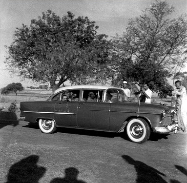 Meherabad, India - Feb.1958 ; Meher Baba in the rear of Meherjee's car, with Kumar in the front with the driver. Photo taken by Meelan 