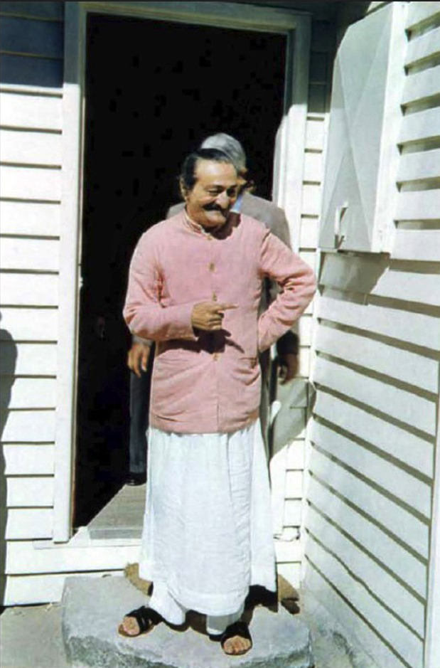  Meher Baba standing in the doorway of Meher House. Adi K. Irani standing behind Baba.