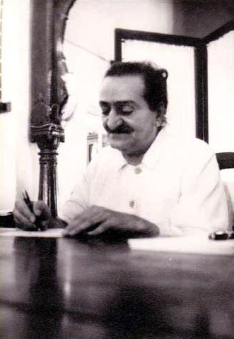 Meher Baba signing copies in Satara in early 1955