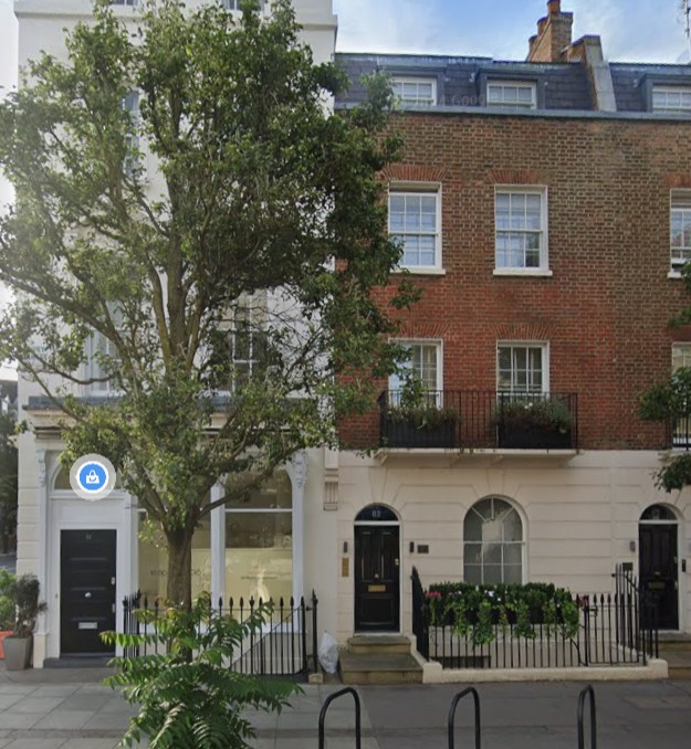 83 Ebury Street London. Red brick building, centre door.