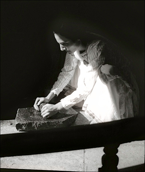 Mehera using her grinding stone set, mid-1930s
