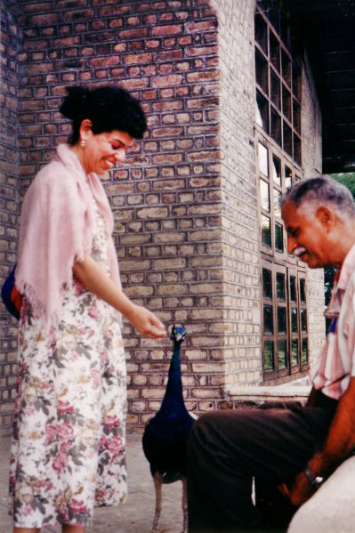 Bobbi feeding a peacock with Jal Dastoor in India