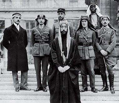 Interestly, Lawerence ( of Arabia ) is standing on the right of the Arabian king.