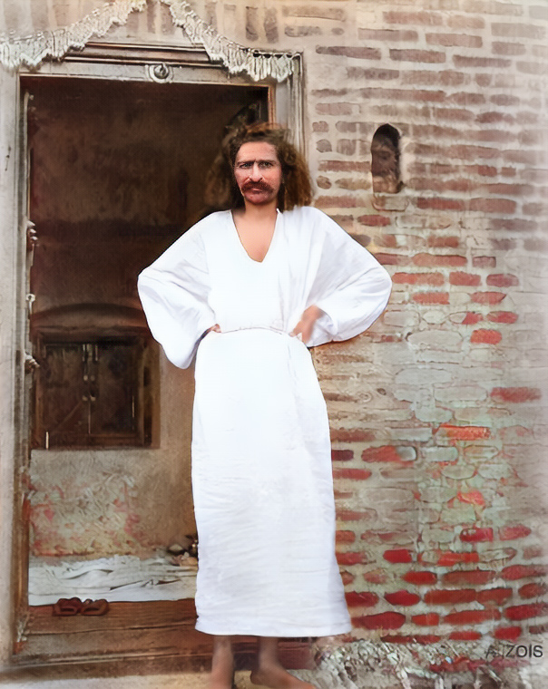 Baba at Toka in 1928. Standing in front of the door that will later be transported to Meherabad and become the Samadhi door. Image colourized & enhanced by Anthony Zois.