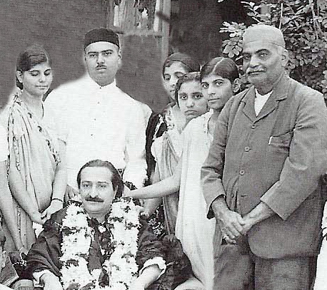 Cropped image from Lord Meher & edited. Short lady in image is not known.