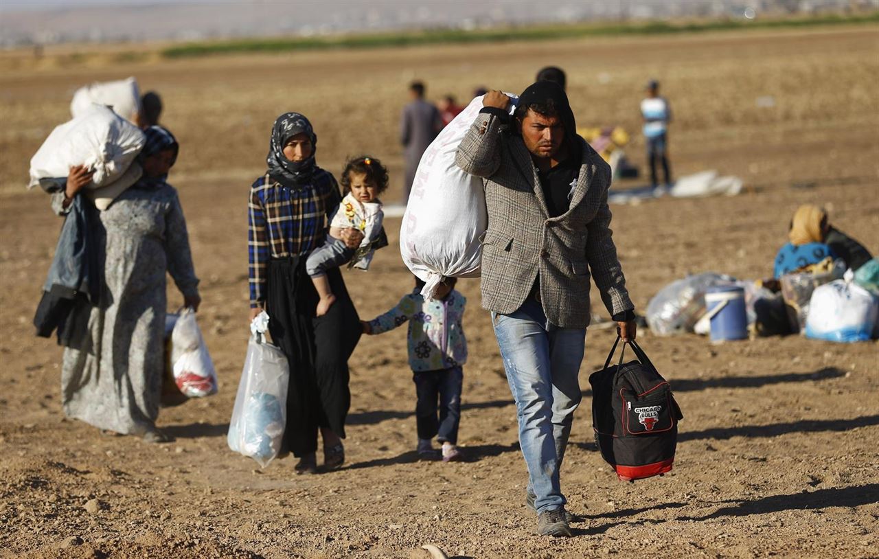 Una familia de kurdos sirios en Suruc (2014). Murad Sezer/Reuters
