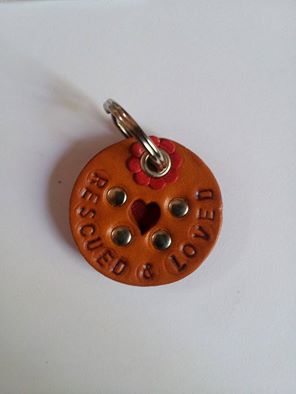 Leather tag "rescued and loved", heart peephole with red leather, (red) flower at ring, 3,5 cm (1.4"), 12 euro