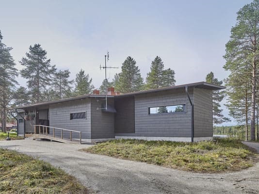 Holzhaus in Blockbauweise - Wohnblockhaus mit Pultdach  - Blockhaus am See 