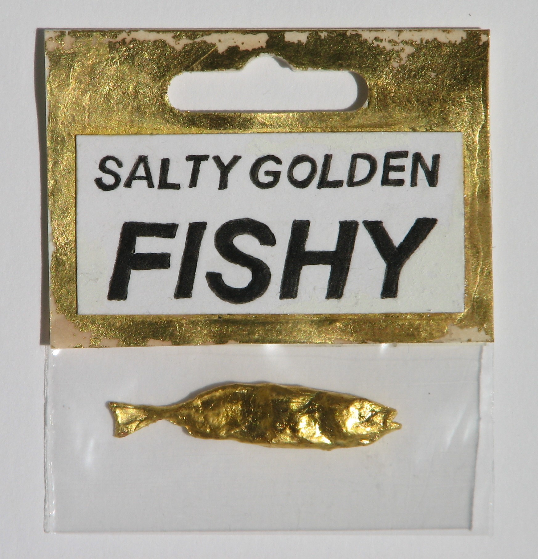 Salty Golden Fishy  2016  Gilt Fish in Packaging  4,6 x 1cm