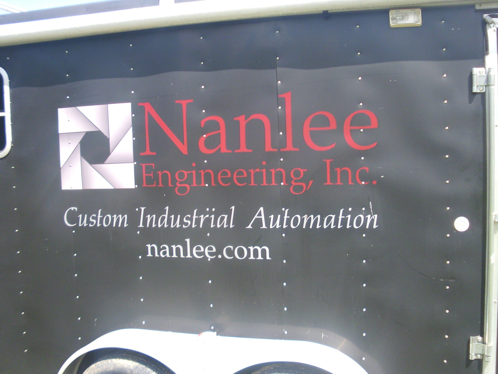 Nanlee Engineering Mobile Manufacturing trailer with name