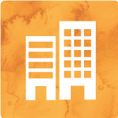 Silhouette zweier Hochäuser auf orangenem Hintergrund