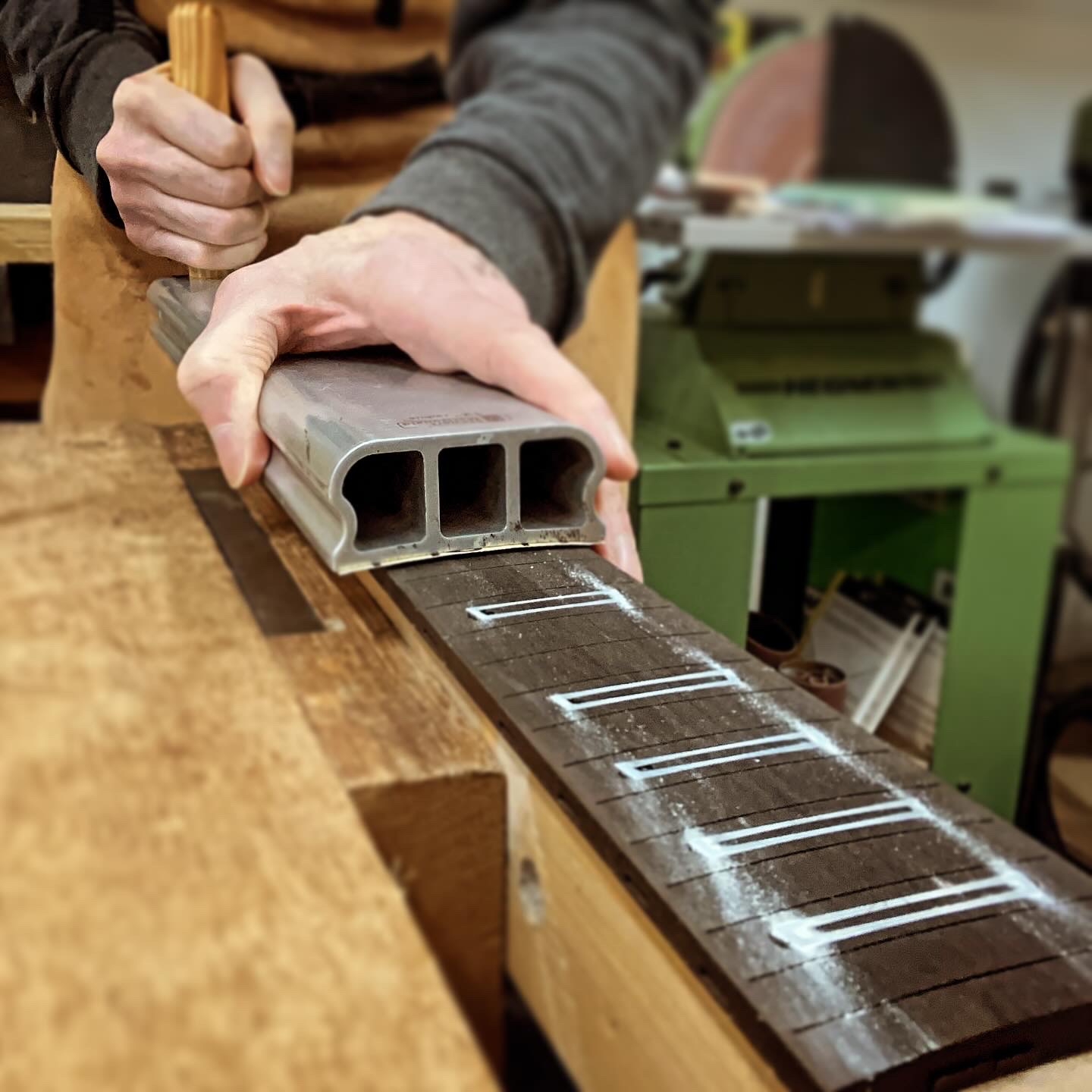 Sanding the fretboard inlay