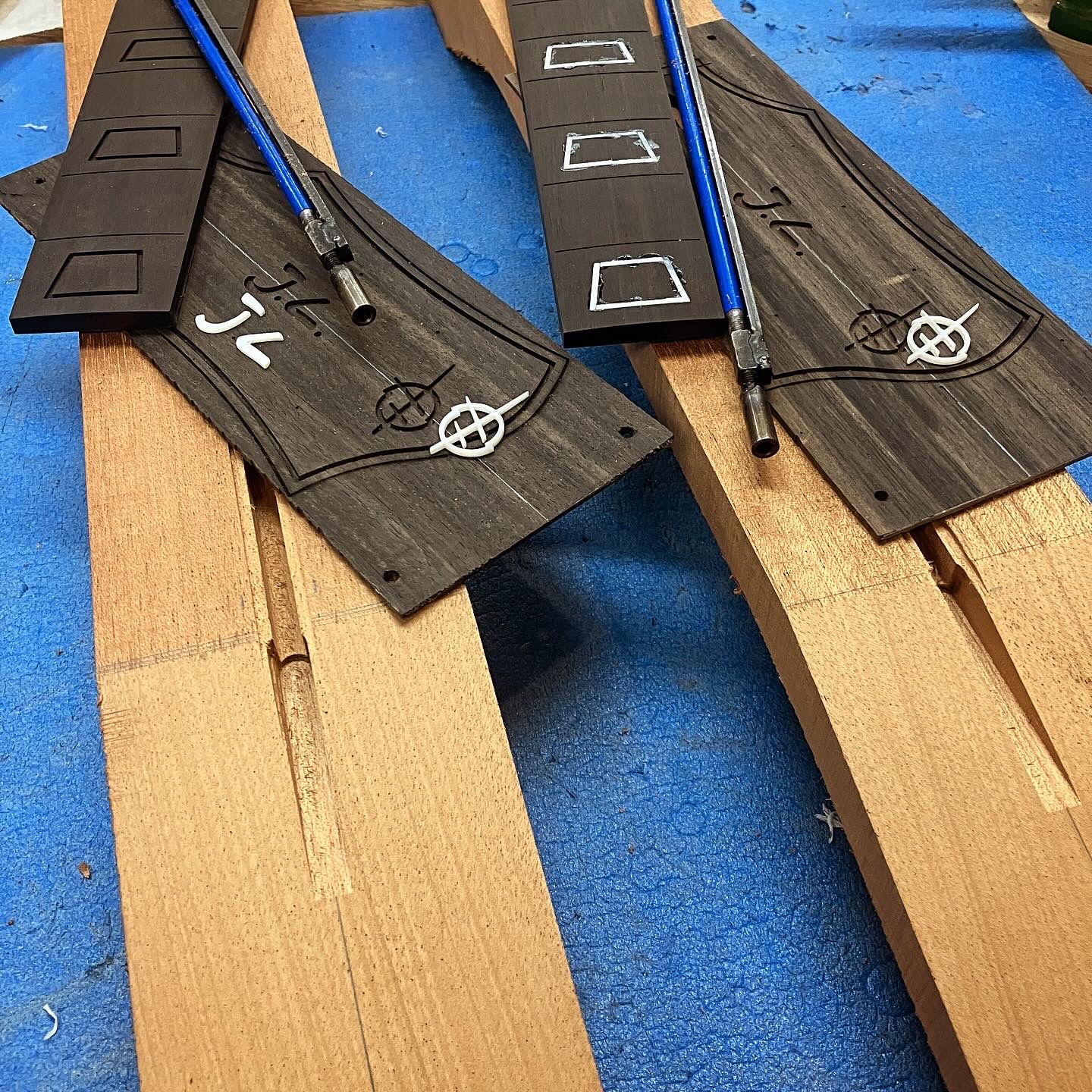 Headstock plates and inlays