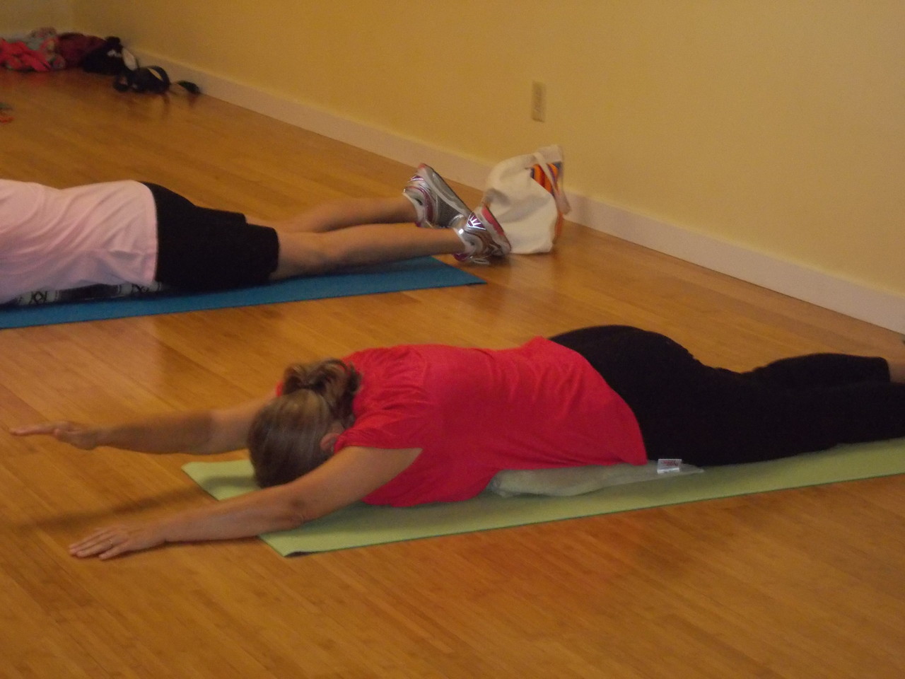 Front spine on blanket, extend the right arm and elevate to strengthen the posterior shoulder