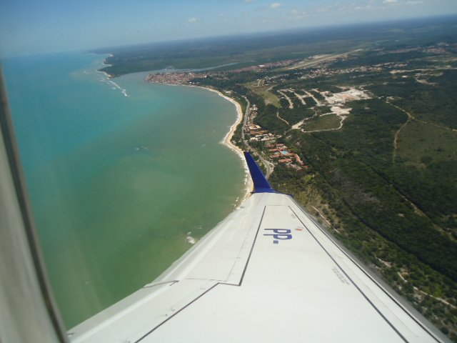South Bahia coast, seen from the plane, which lands in Porto Seguro, seen at the back of the picture