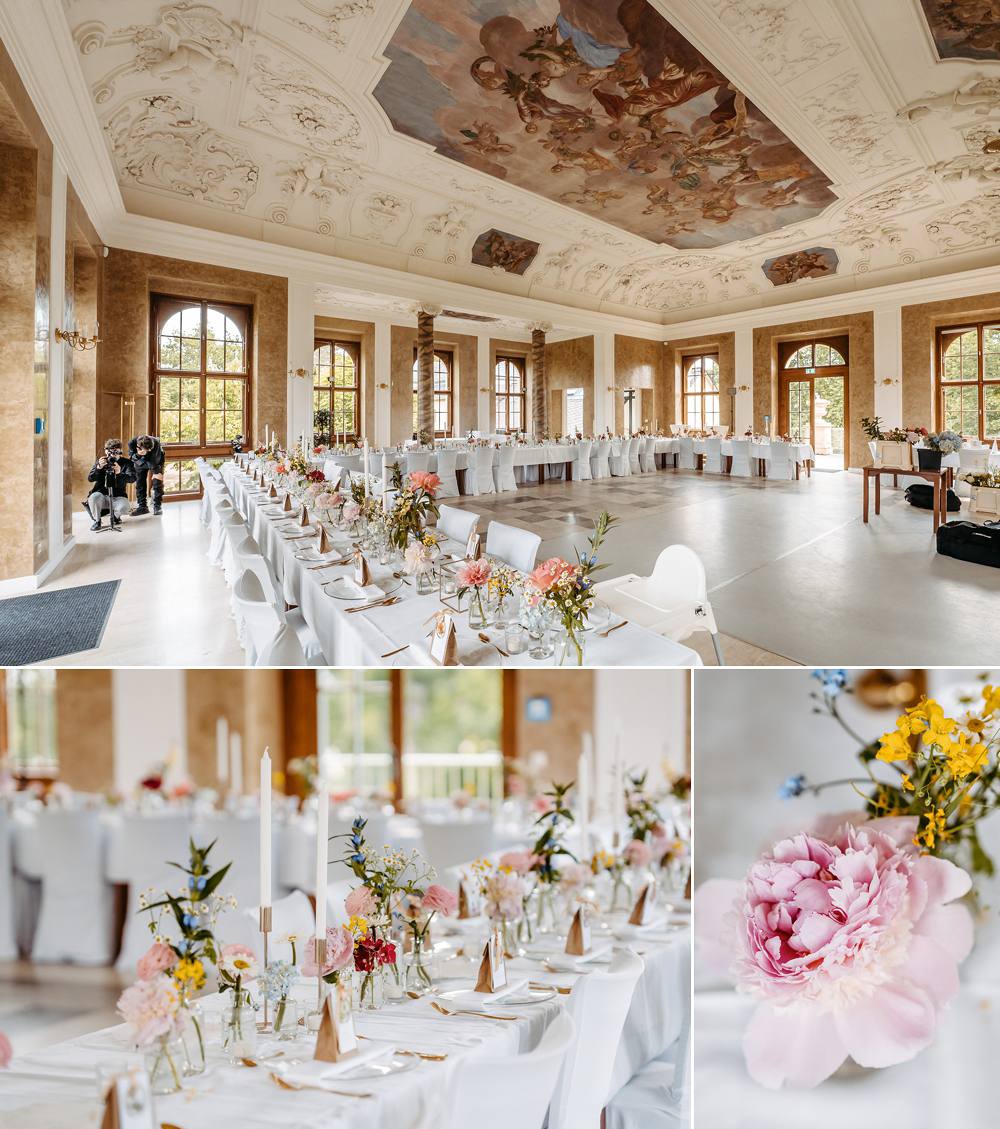 Ein Blick in den Saal zeigt die harmonische Verbindung aus barocker Architektur und moderner, bunter Floristik.