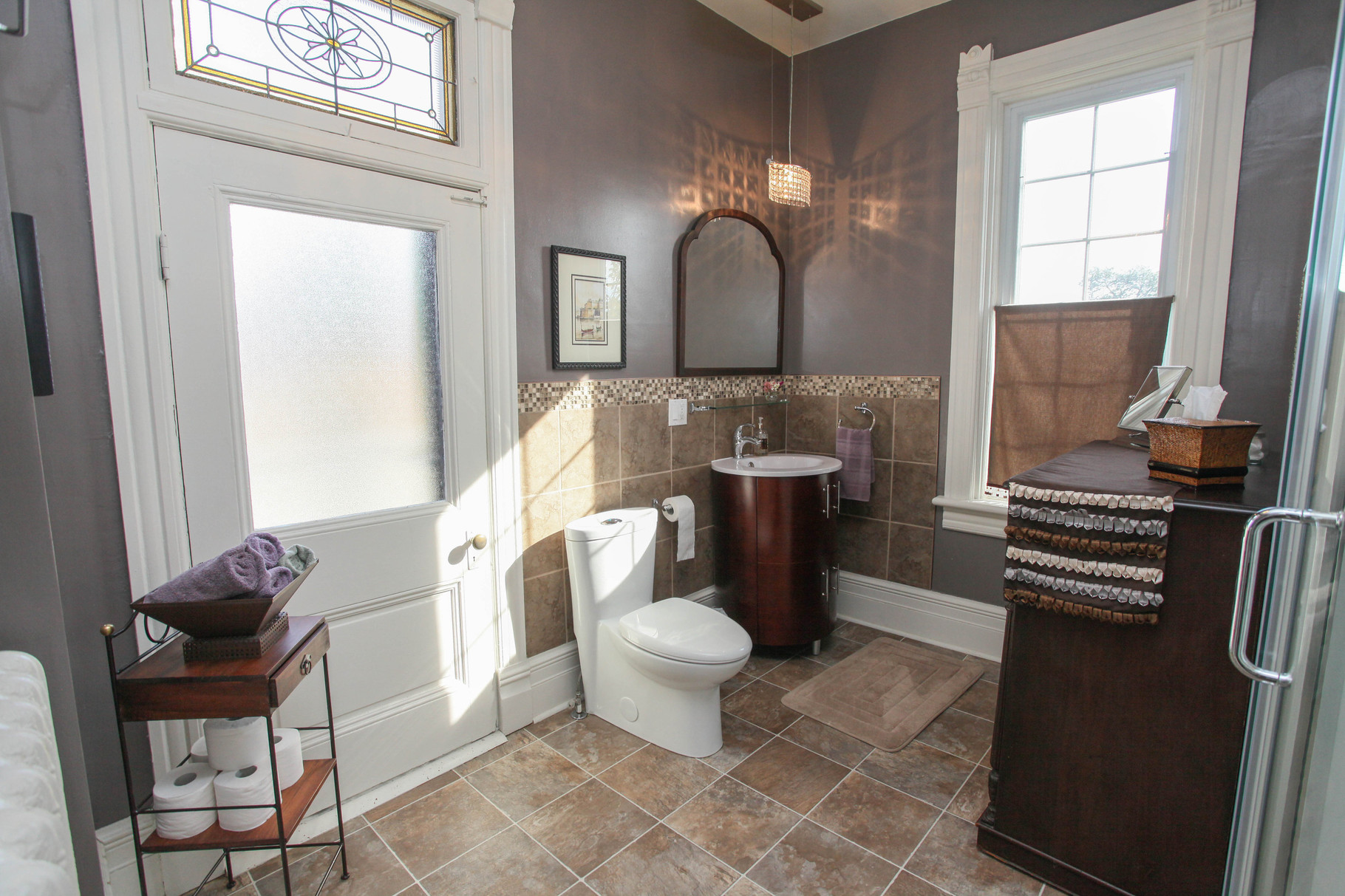 Adjacent private bathroom for Jane's Room 1 guests equipped with a spa-style rainfall shower