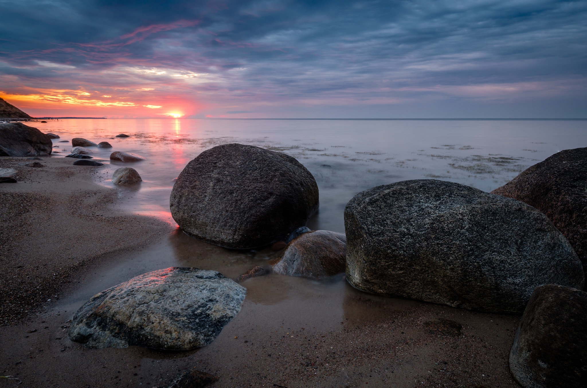 Sonnenuntergang mit versteinerten Meerjungfrauen am Weißenhäuser Strand