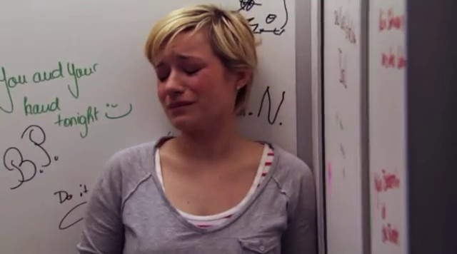 Jenny apologizes to Emma in the school's restrooms.