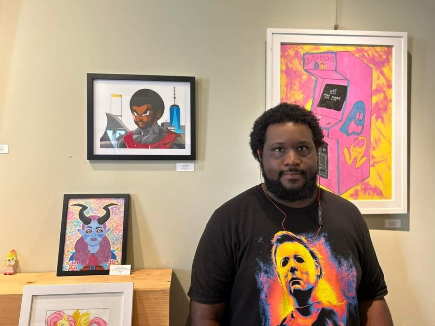 Jeremiah Gallow poses with his self portrait inspired by anime