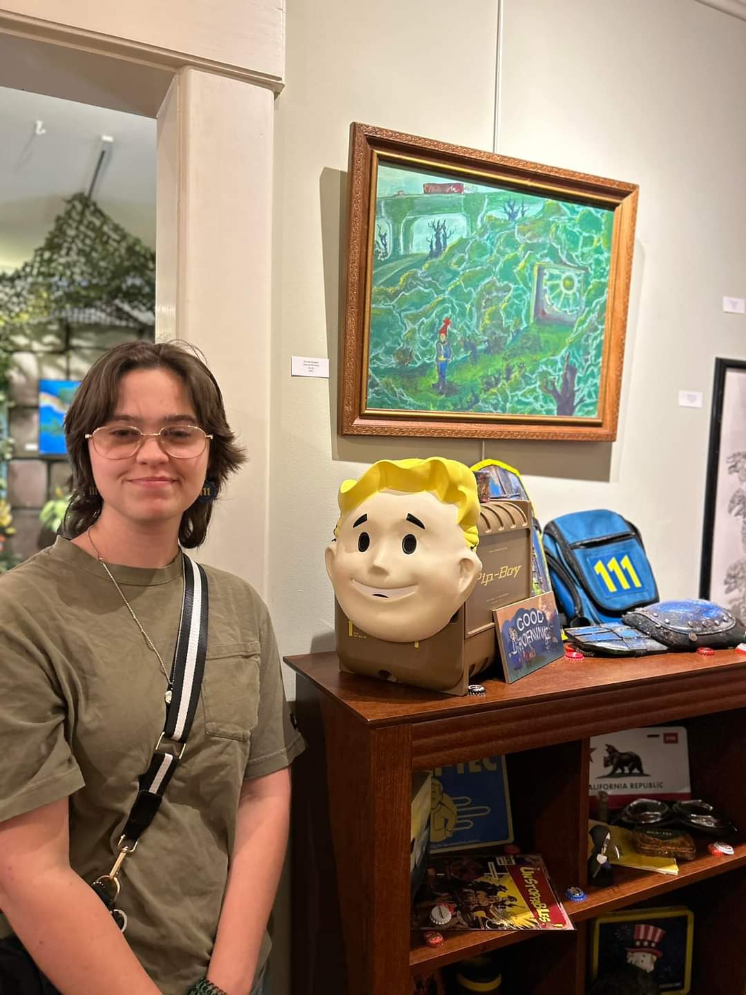 Nichole Douglas with their painting "Leaving the Vault"