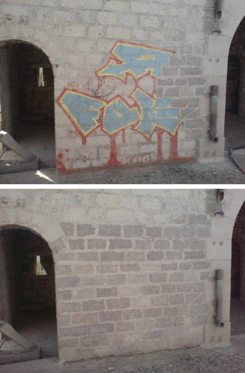 Nettoyage de graffitis sur pierre froide.