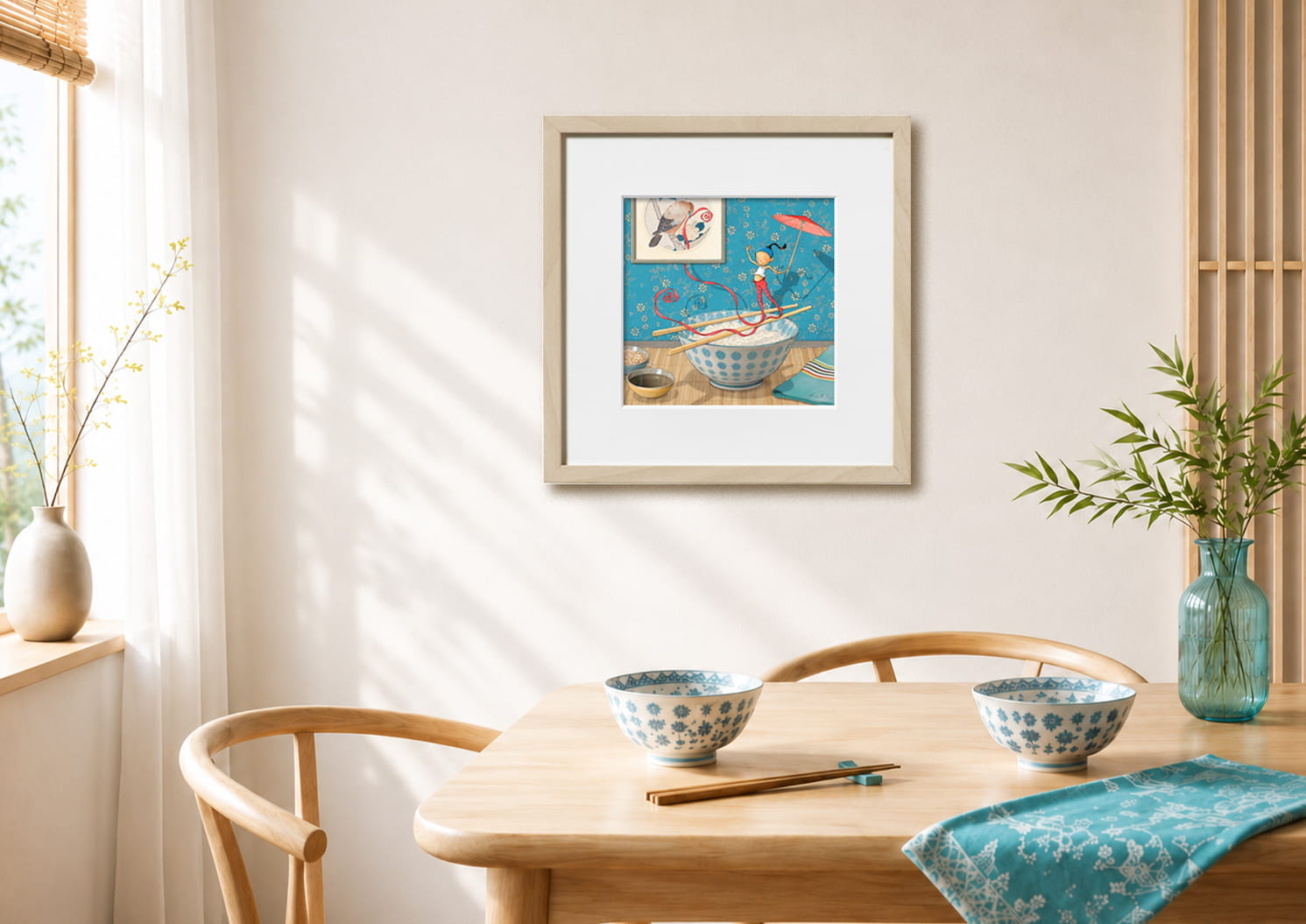 Illustration encadrée au mur de "Bol de rizette" de Timeliot. Il est en équilibre sur des baguettes au dessus d'un bol de riz