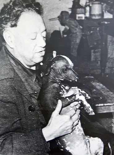 Diego Rivera with a xoloitzcuintle.