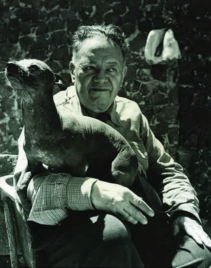 Diego Rivera posing with Mr. Xolotl