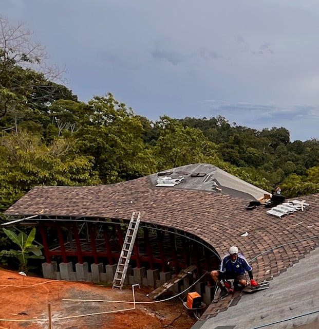 August 2023 - the roofer at work with the pneumatic nailer