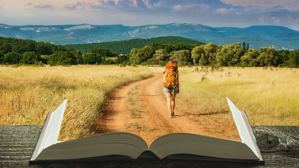 Dieses offene Buch, symbolisiert das Schreiben eines neuen Kapitels auf der Lebensreise.